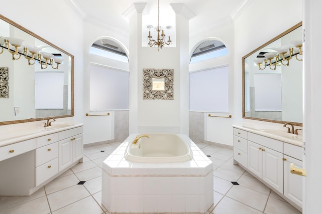 bathroom with ornamental molding, vanity, a notable chandelier, a relaxing tiled tub, and tile patterned flooring