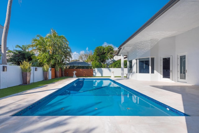 view of swimming pool with a patio area