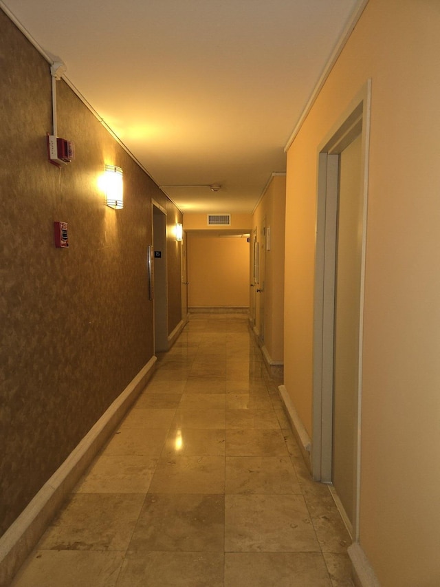 hallway with crown molding