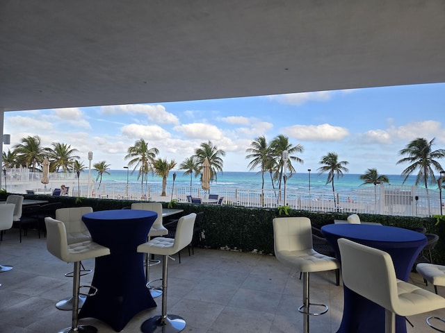 view of patio with a water view