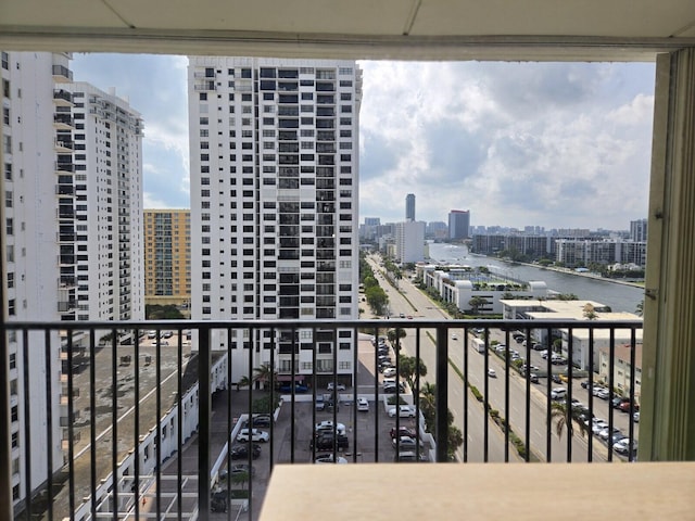 balcony featuring a water view