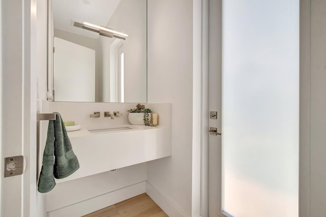 bathroom featuring vanity and hardwood / wood-style floors