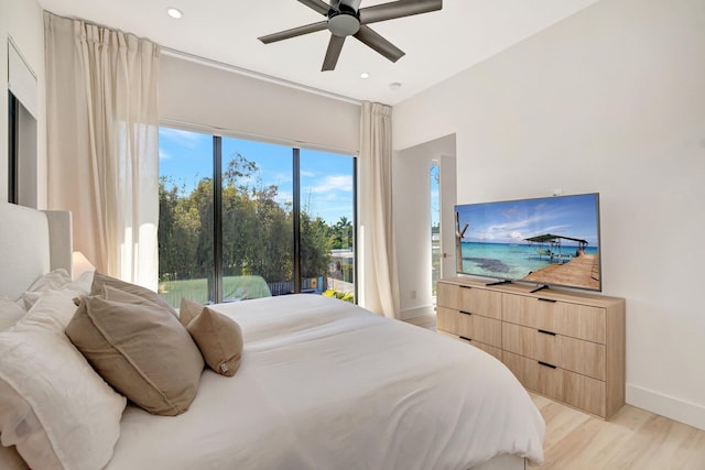 bedroom featuring ceiling fan and light hardwood / wood-style floors