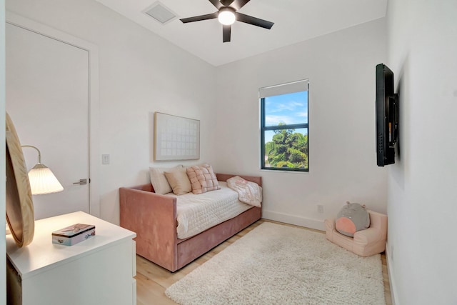 bedroom featuring light hardwood / wood-style flooring and ceiling fan