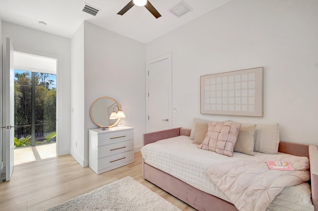 bedroom featuring access to exterior, ceiling fan, and light hardwood / wood-style flooring