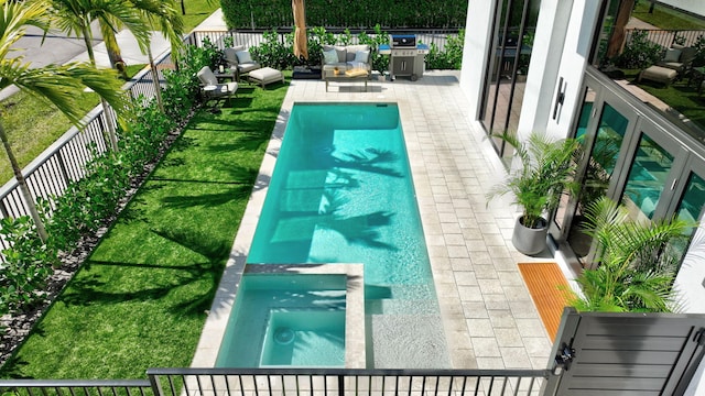 view of pool featuring grilling area and a patio area