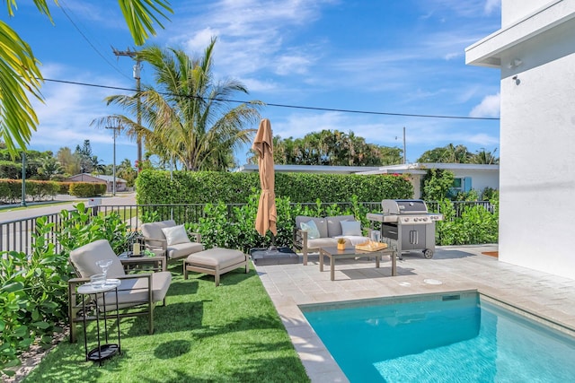 view of swimming pool featuring area for grilling, an outdoor hangout area, and a patio