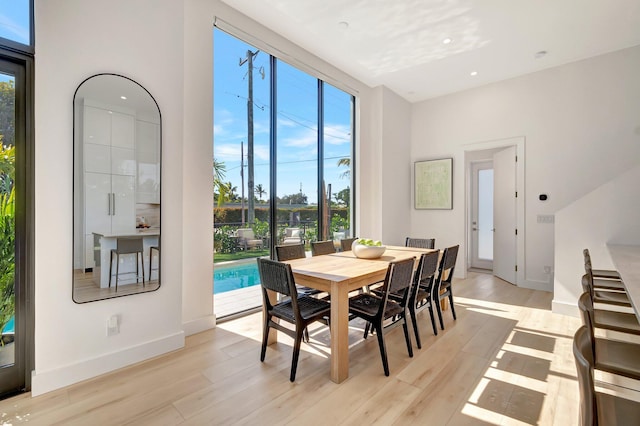 dining space featuring light wood-type flooring