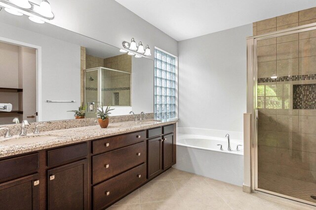 bathroom featuring shower with separate bathtub and vanity