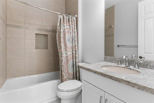 full bathroom with vanity, shower / bath combination with curtain, and toilet