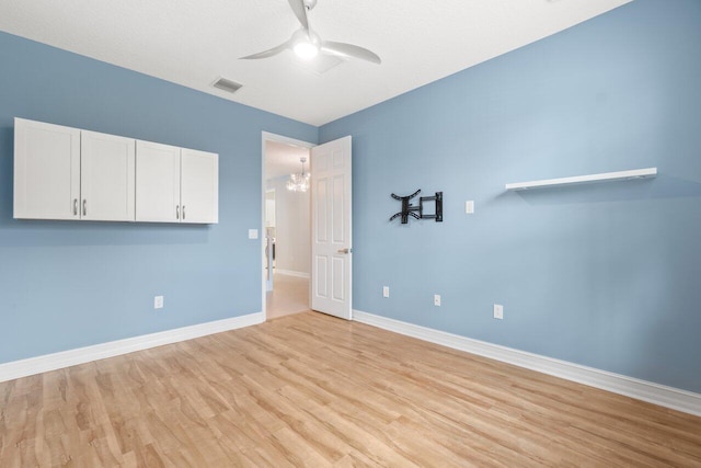 empty room featuring light hardwood / wood-style flooring and ceiling fan