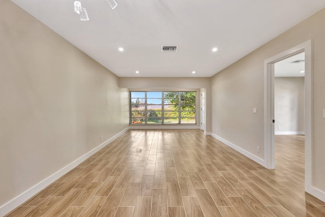 spare room with light wood-type flooring