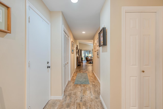 corridor featuring light hardwood / wood-style floors