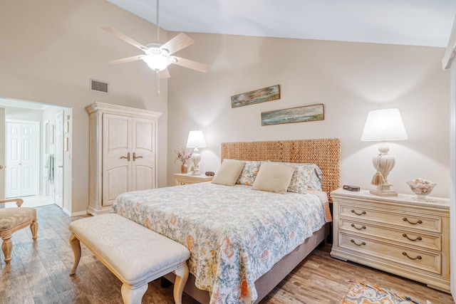 bedroom with ceiling fan, high vaulted ceiling, and light wood-type flooring