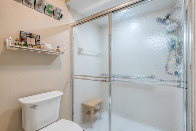 bathroom with toilet and walk in shower