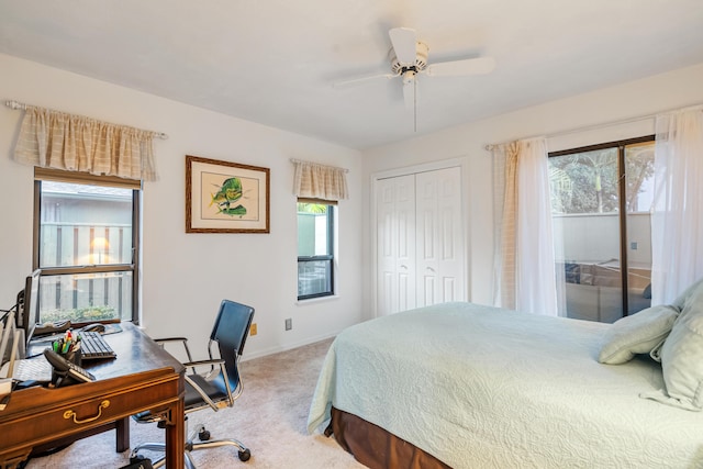 carpeted bedroom with access to exterior, a closet, and ceiling fan