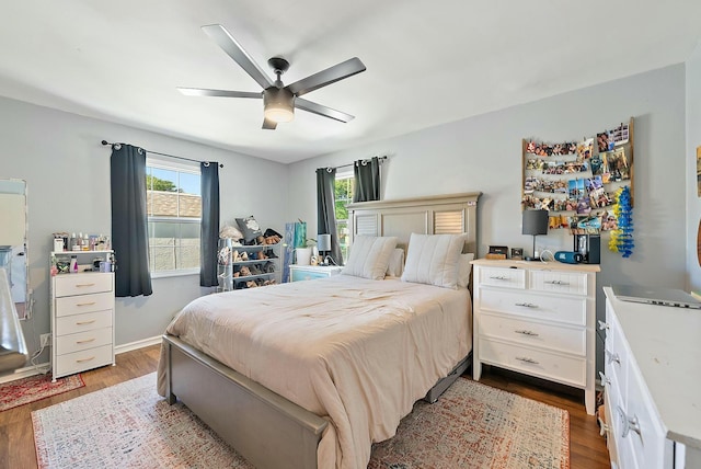 bedroom featuring hardwood / wood-style floors and ceiling fan