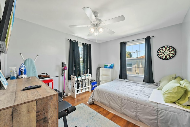 bedroom featuring hardwood / wood-style flooring and ceiling fan