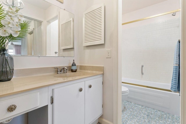 full bathroom with tiled shower / bath combo, vanity, and toilet