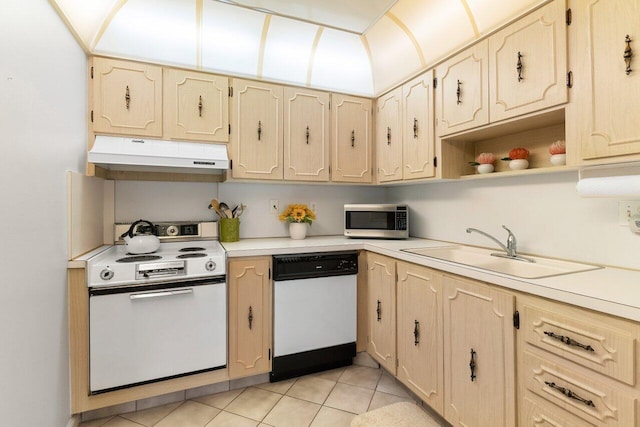 kitchen featuring sink, white appliances, and light brown cabinets