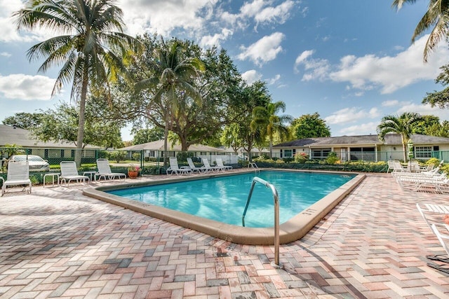 view of swimming pool featuring a patio area