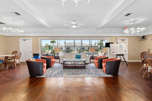 living room with beamed ceiling, dark hardwood / wood-style flooring, and a wealth of natural light