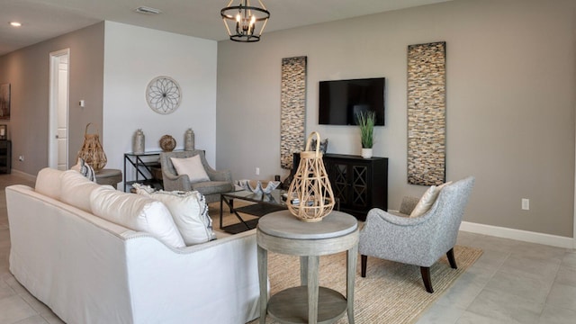 living room featuring light tile patterned flooring and a chandelier