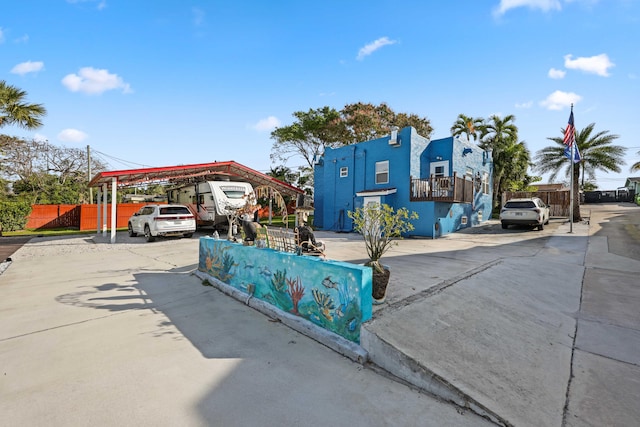 view of front of home with a carport