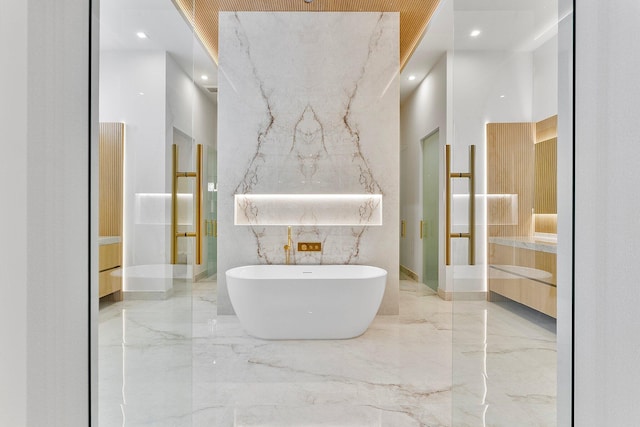 bathroom with vanity and a bathing tub