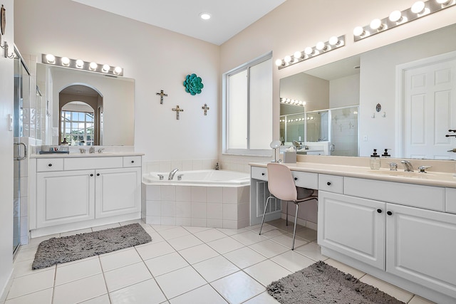 bathroom with independent shower and bath, vanity, and tile patterned flooring