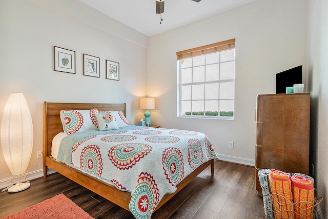 bedroom with dark wood-type flooring and ceiling fan