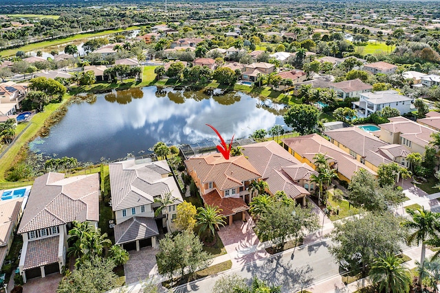 birds eye view of property featuring a water view