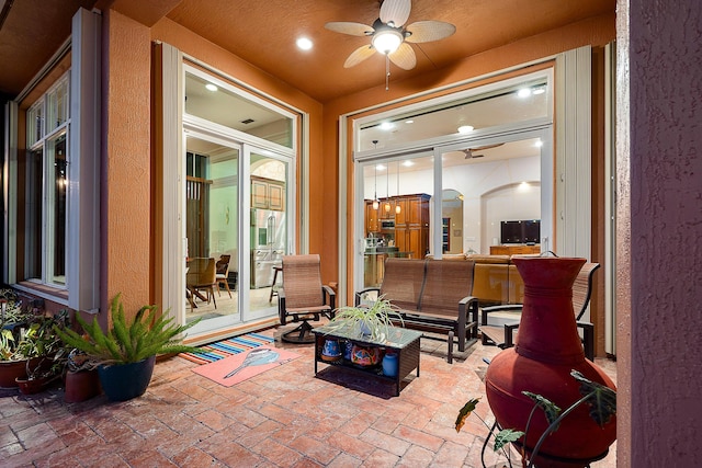 view of patio featuring outdoor lounge area and ceiling fan