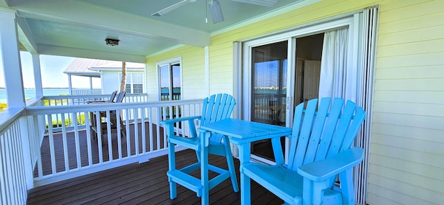 wooden terrace featuring ceiling fan