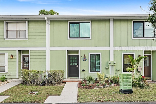 view of property with a front lawn