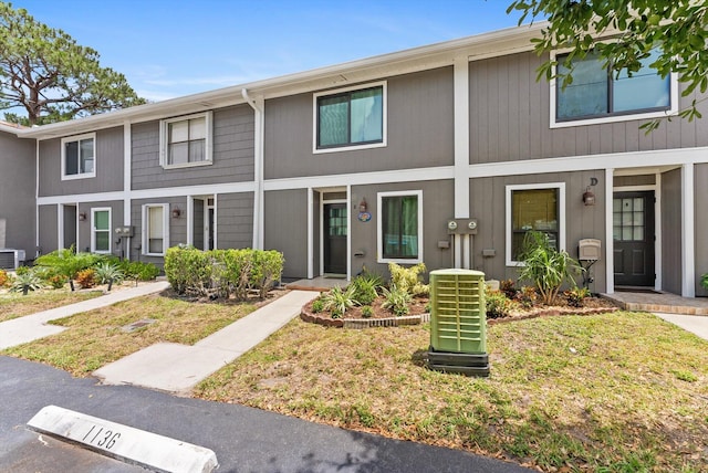 townhome / multi-family property featuring central AC unit