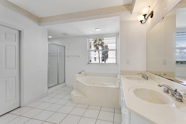 1660 S A1A Unit 222, Jupiter, FL 33477 - bathroom featuring a bath, tile patterned floors, a shower stall, and double vanity