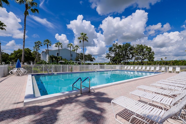 view of swimming pool featuring a patio area