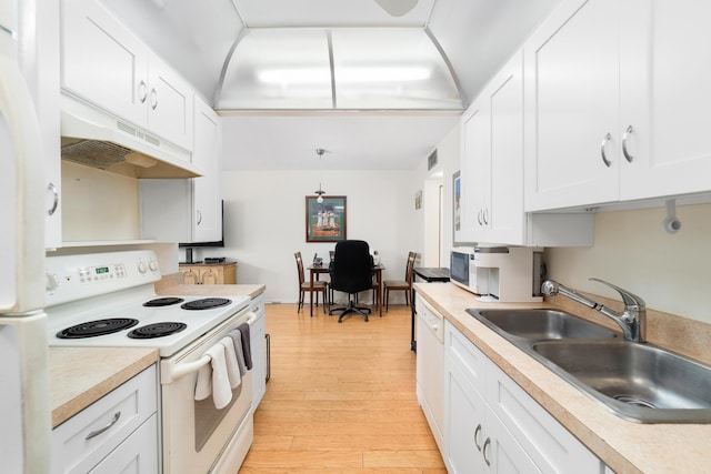 kitchen with light wood-type flooring, white appliances, sink, and white cabinets