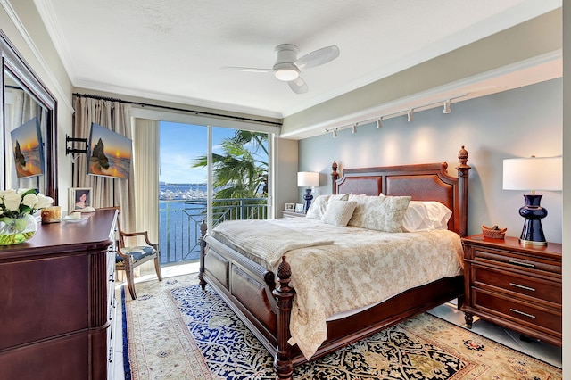 bedroom with crown molding, rail lighting, access to outside, and ceiling fan