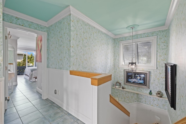 bathroom with crown molding and tile patterned floors