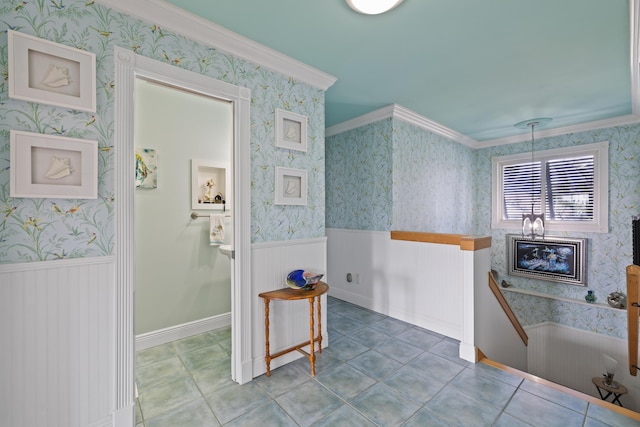 bathroom featuring tile patterned flooring and crown molding