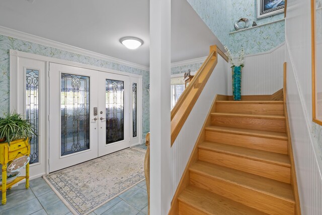 bedroom featuring ensuite bath, ornamental molding, and light hardwood / wood-style floors