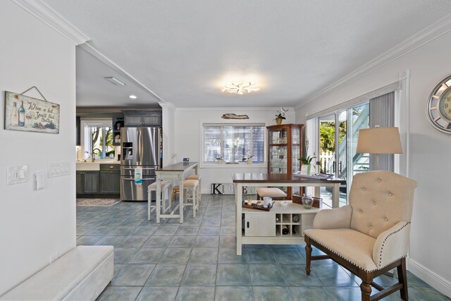 tiled living room with ceiling fan, crown molding, and a textured ceiling