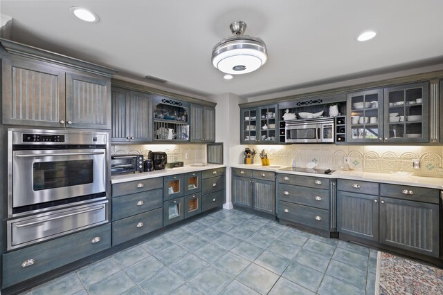 dining area with light tile patterned flooring, ornamental molding, and a textured ceiling