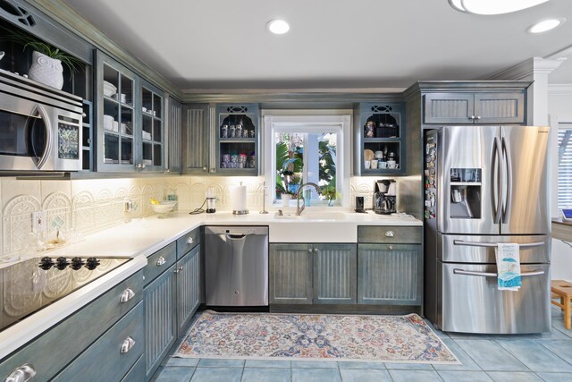 dining room with ornamental molding, light tile patterned floors, a textured ceiling, and ceiling fan