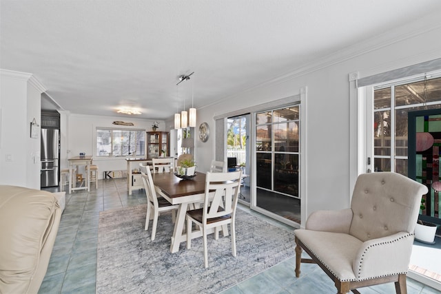 dining space featuring crown molding, tile patterned flooring, and a textured ceiling