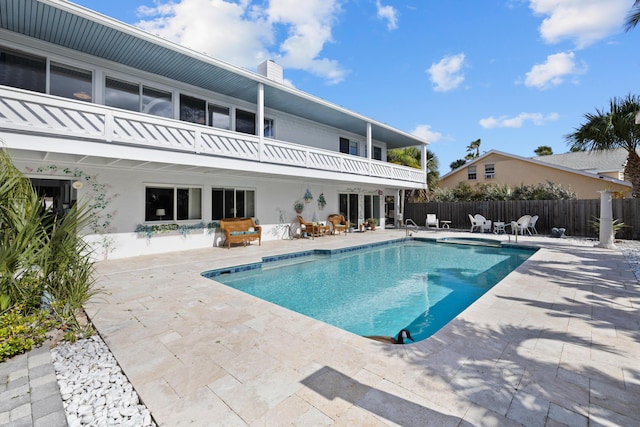 view of swimming pool featuring a patio area