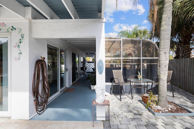 view of patio / terrace with a lanai