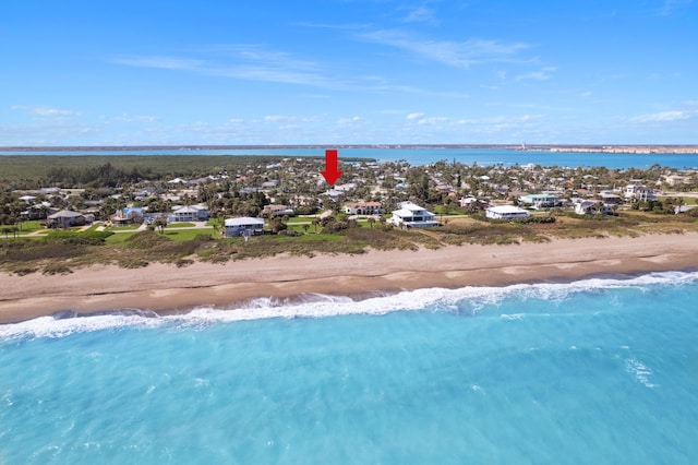 drone / aerial view with a view of the beach and a water view